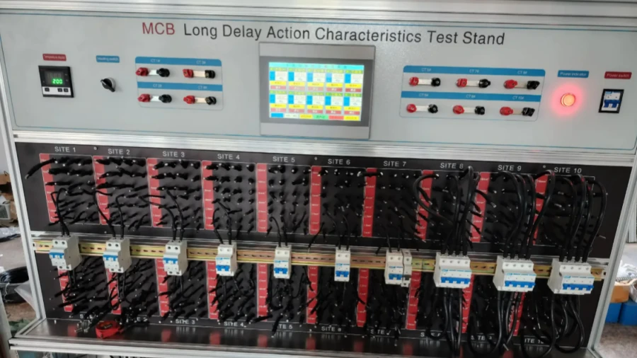 A testing machine labeled MCB Long Delay Action Characteristics Test Stand, with a digital display, control buttons, indicator lights, and ten test sites connected to circuit breakers and wires.